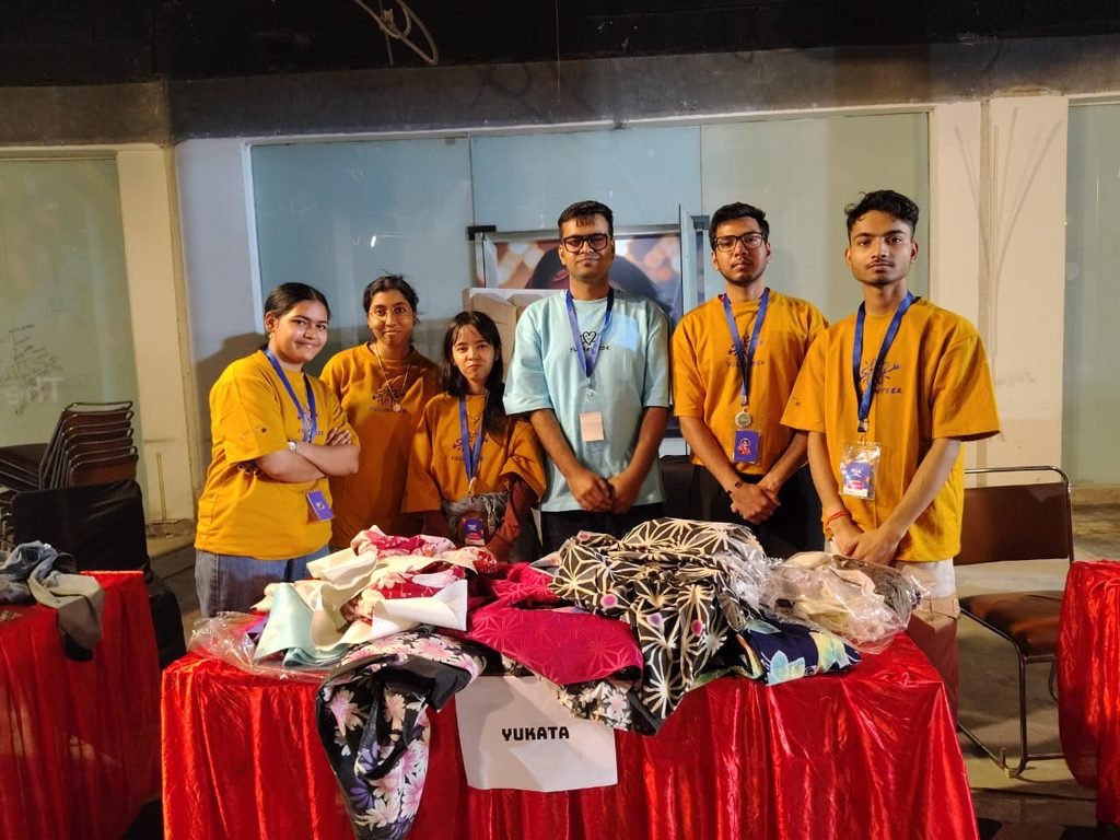 Ananya Mukesh (standing 2nd from left) with fellow volunteers pose in front of Yukata stall at Social Con, 2-day pop-culture and youth festival held on 04-05 April 2026 at Gurugram, Haryana, India