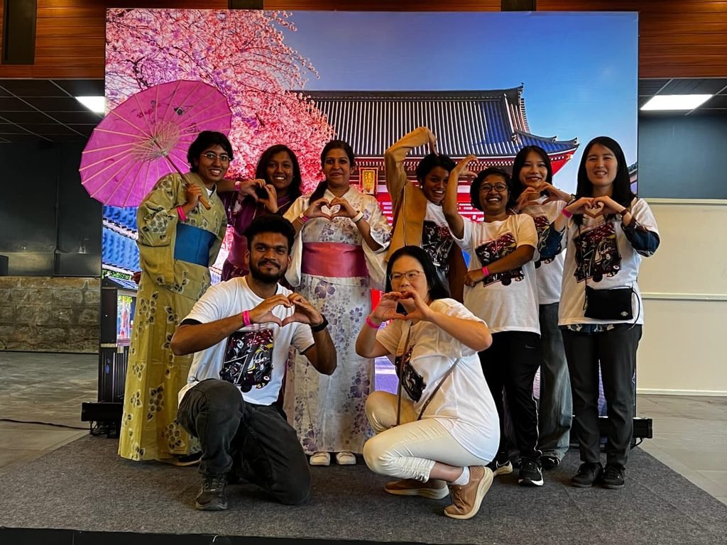 Ananya Mukesh (standing 1st in left) wearing Yukata and holding an umbrella while posing with volunteers of Japan Habba at Bengaluru in January 2025